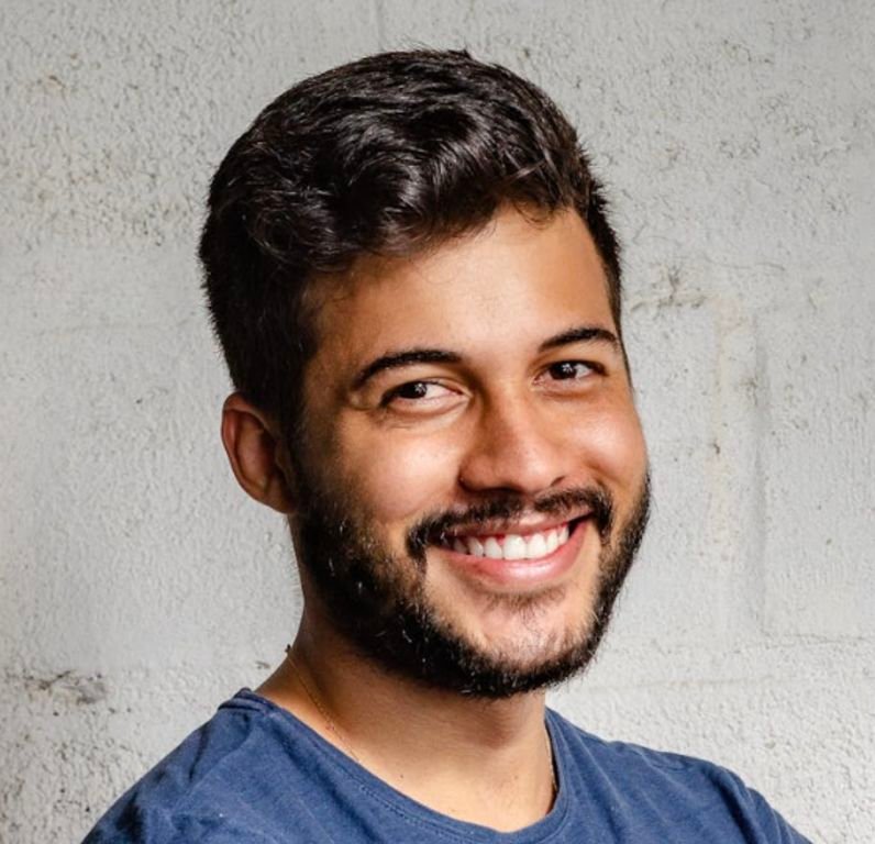 a man smiling at the camera